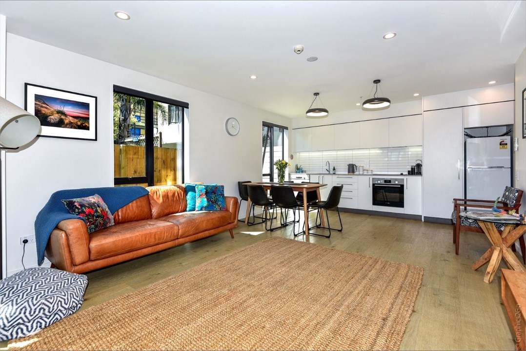 Living room has a TV and seating areas