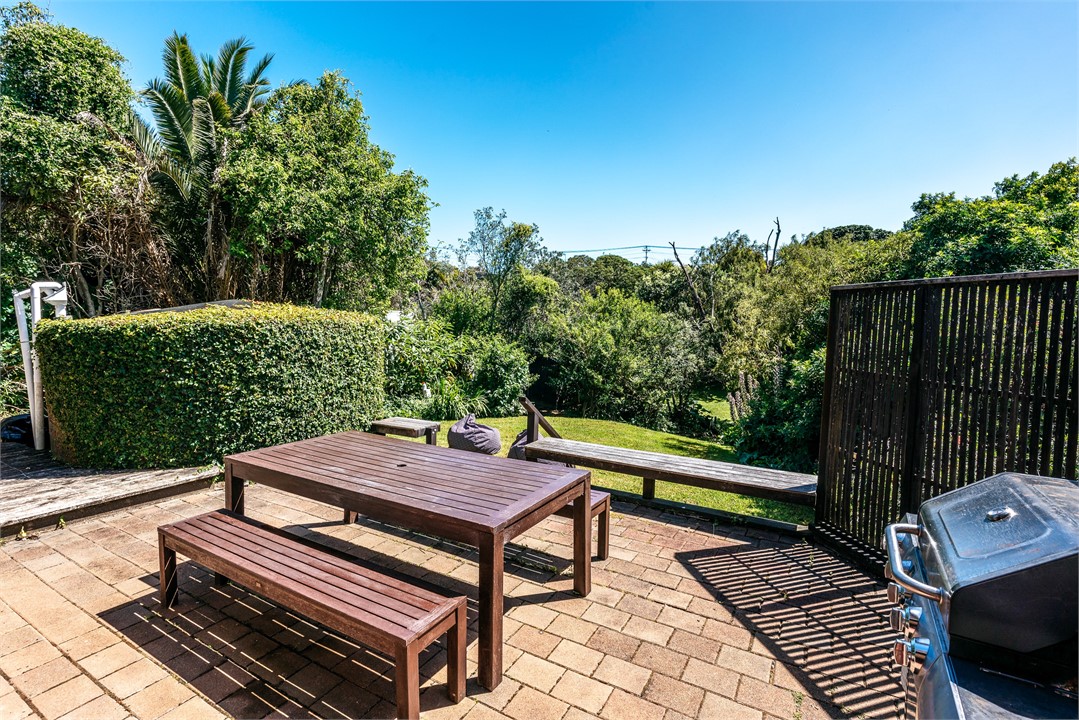 Back patio and lawn with BBQ.