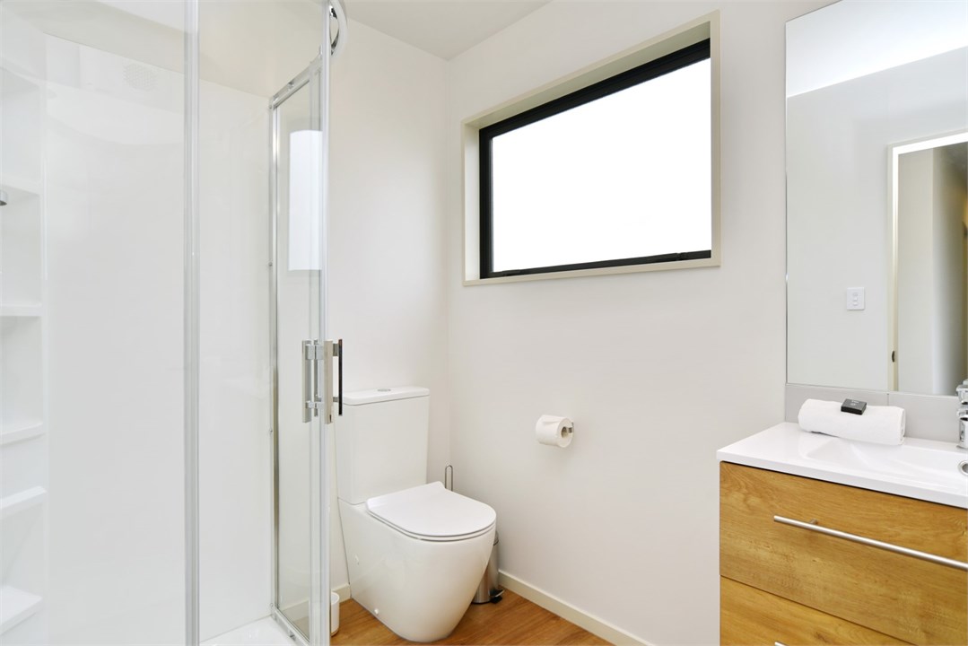 Bathroom 2 has a shower and a toilet