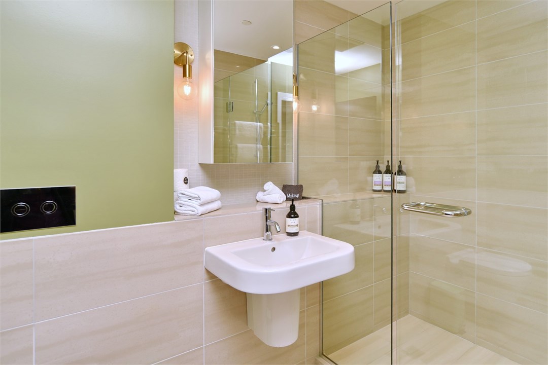 Bathroom 3 has a shower and a toilet