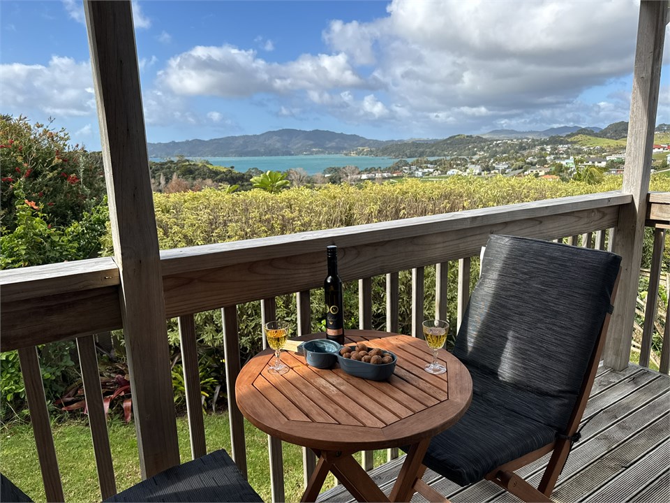 Enjoy view and wine from deck at Casa Playa de los