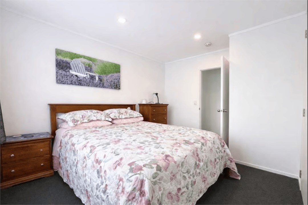 Light, airy queen bedroom for a restful night’s sl