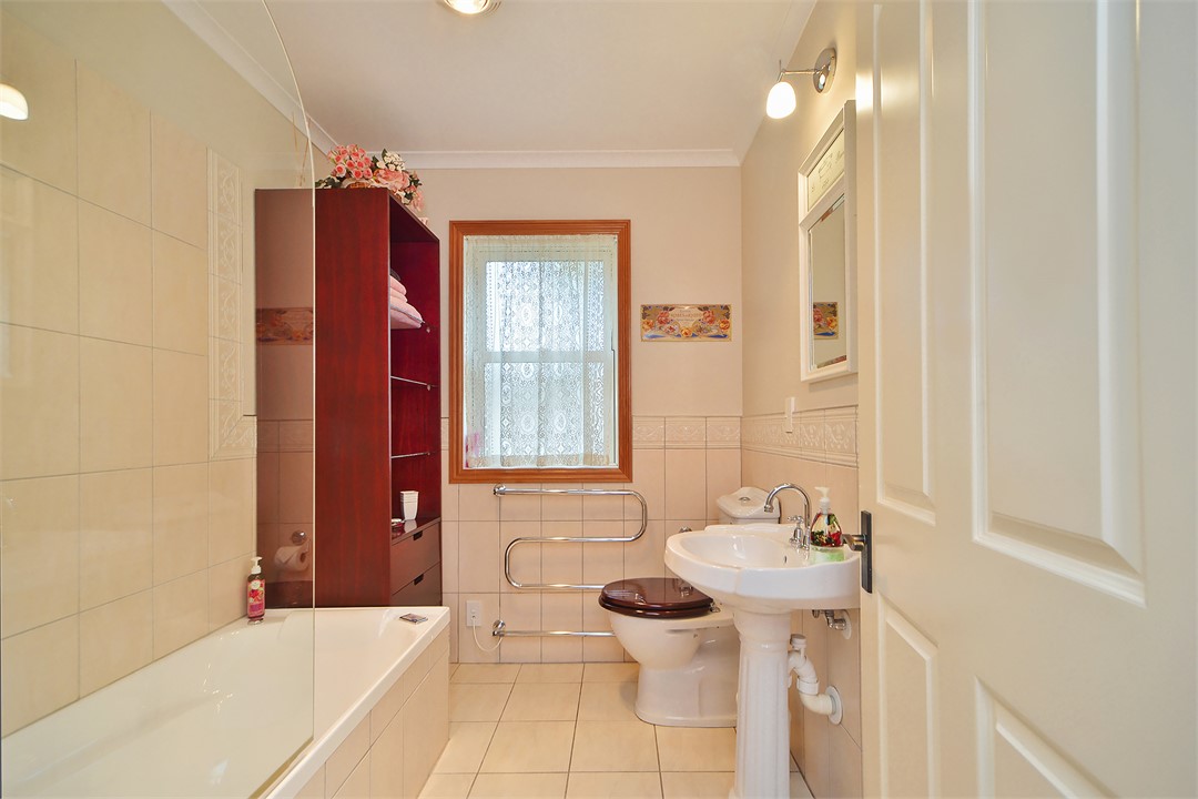 Tiled bathroom with spa bath