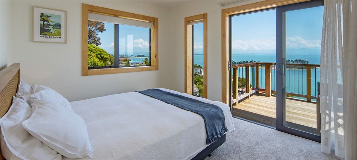 Bedroom 1 with Queen bed and Sea views