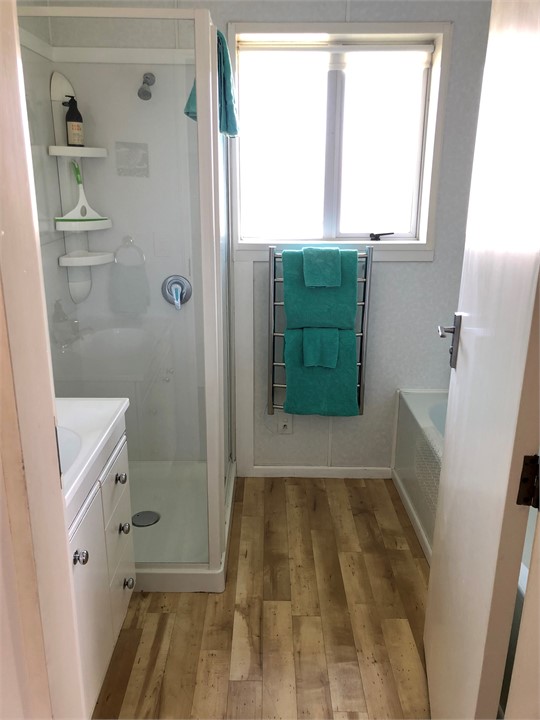 Bathroom with shower and bath