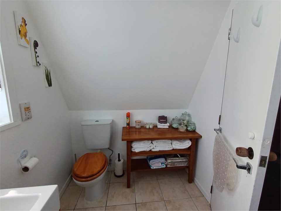 Upstairs bathroom with deep full-sized bath