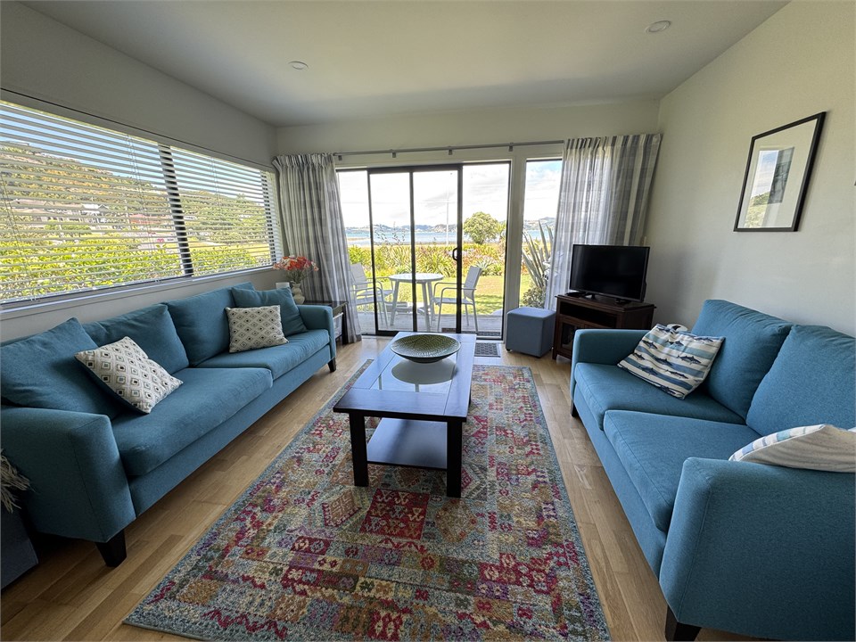 Open plan living out to deck