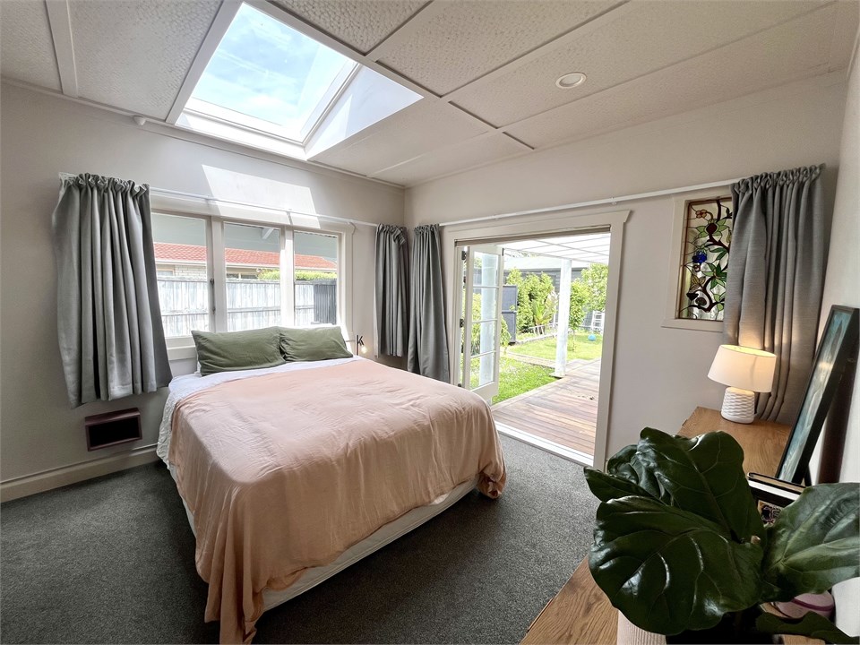 Main bedroom with king bed and french doors