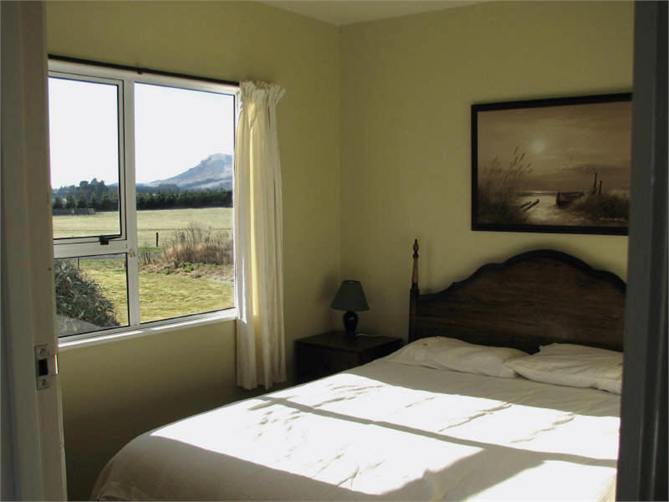 Main bedroom (Queen bed) and view to hills.