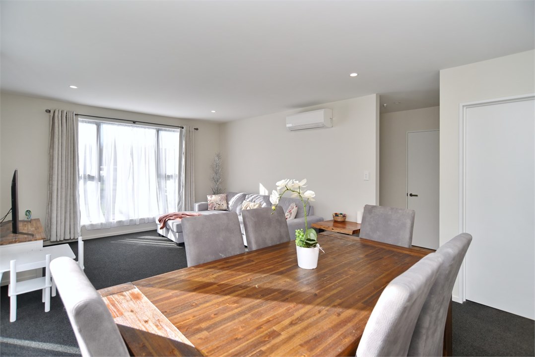 Dining table that seats 6, living area in the back