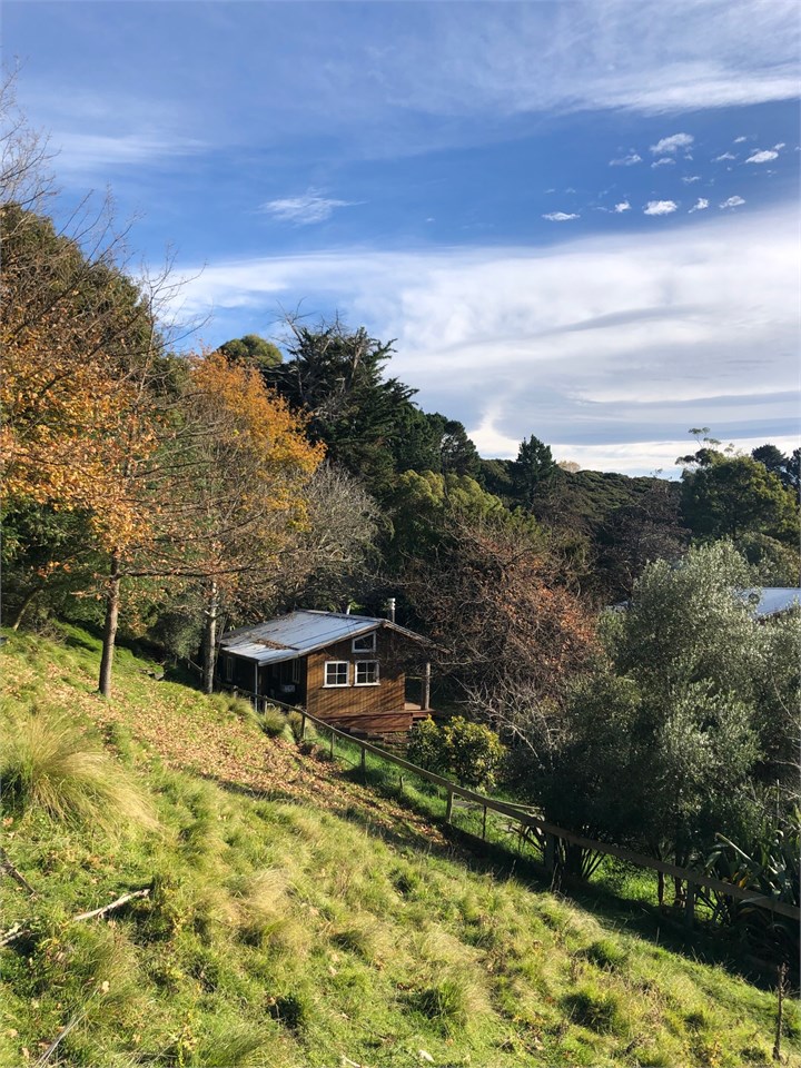View of cottage from hill