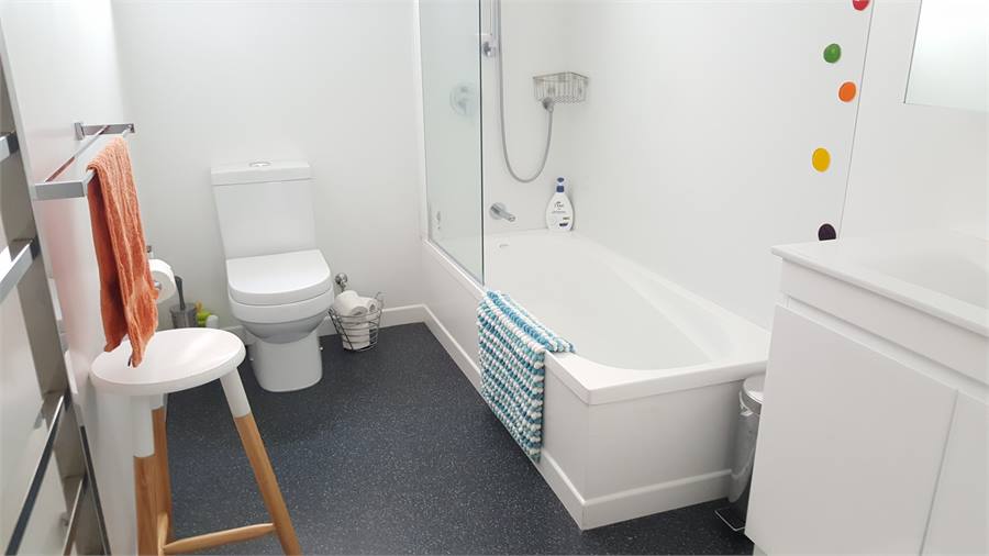 Bathroom with shower over bath.