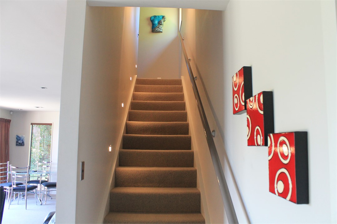 Stairs to bedrooms and extra bathroom