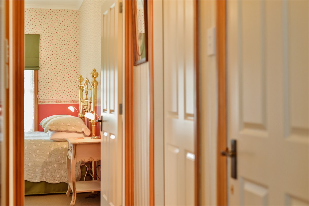 Hallway looking into 1st bedroom