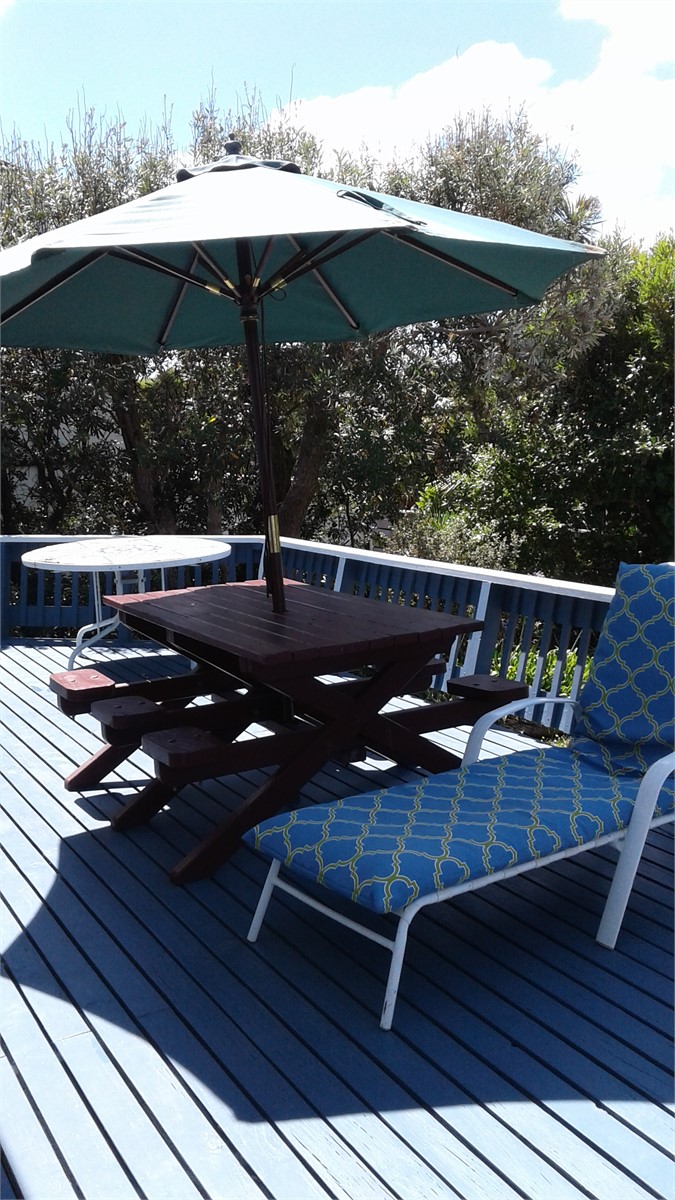 Sheltered back deck with furniture
