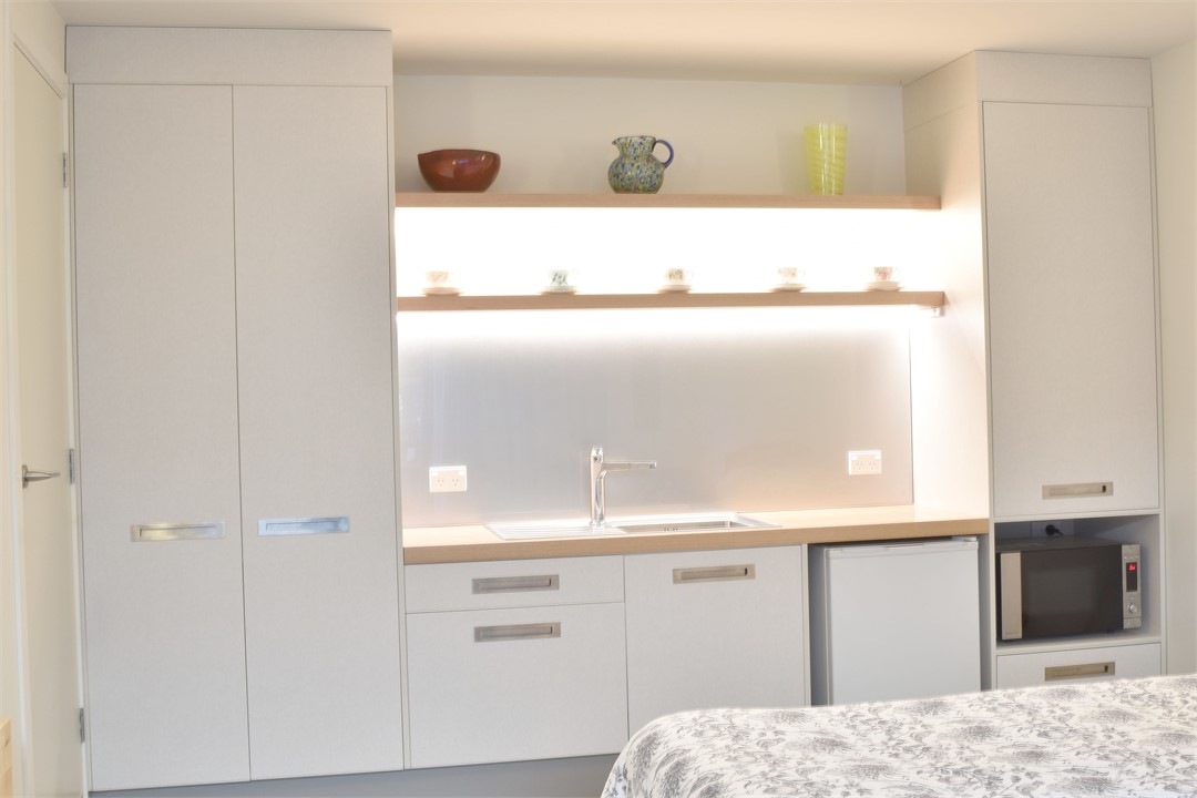 Days Bay Studio Accommodation: Open plan kitchen,