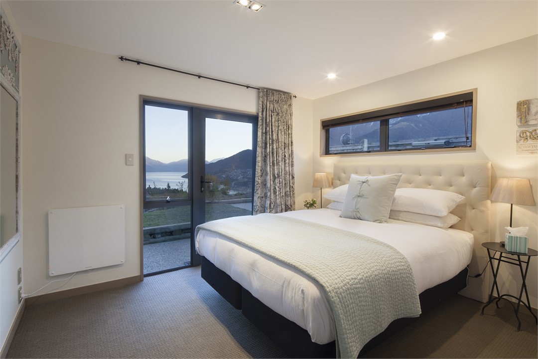 Queenstown bedroom with ensuite and doors leading