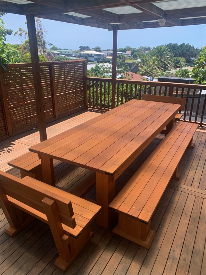 Back deck banquet table seats 18, cushions provide