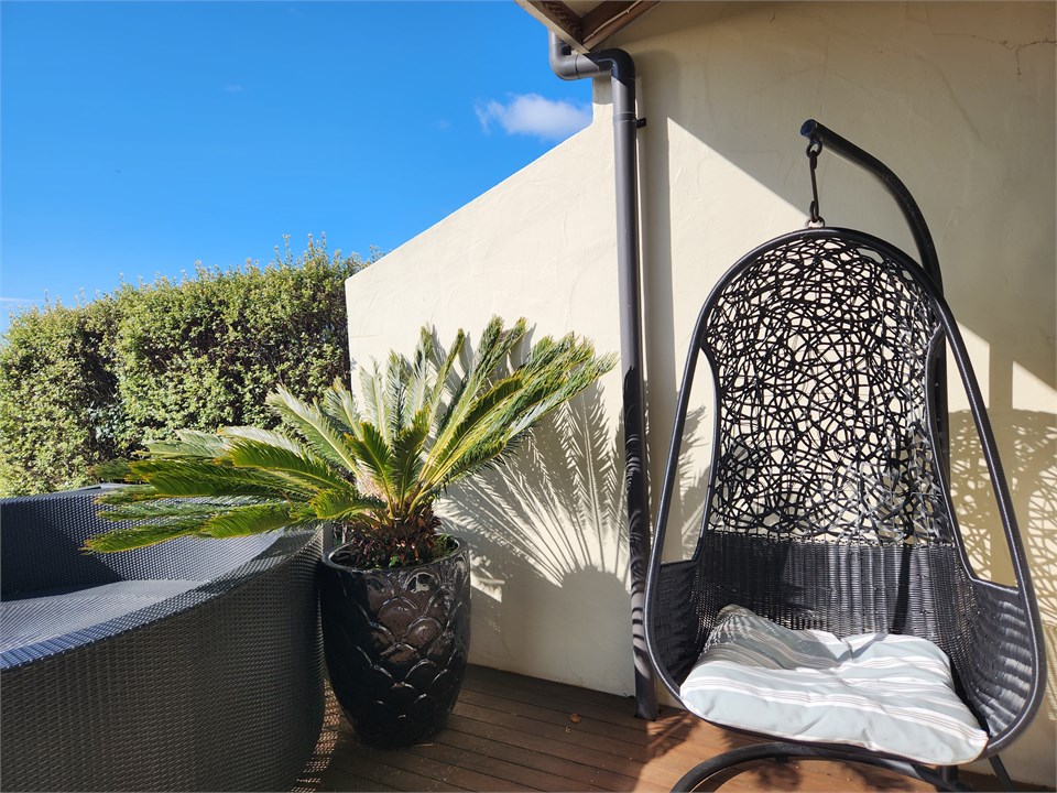 Large deck area with Swing chair, lounging area pl