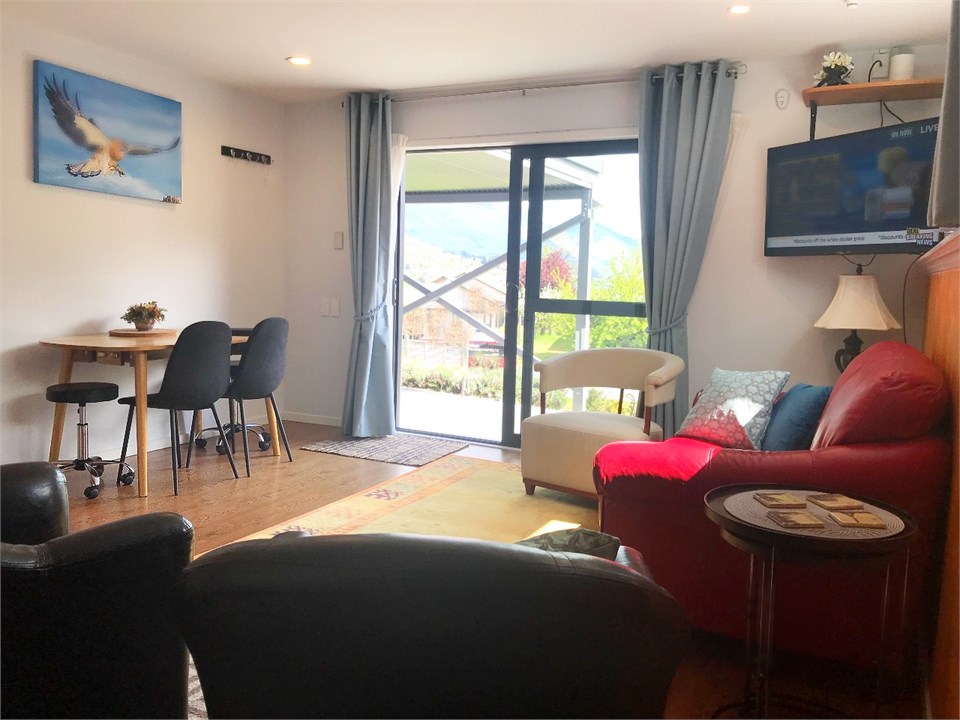 Open plan living area with easy access to carport