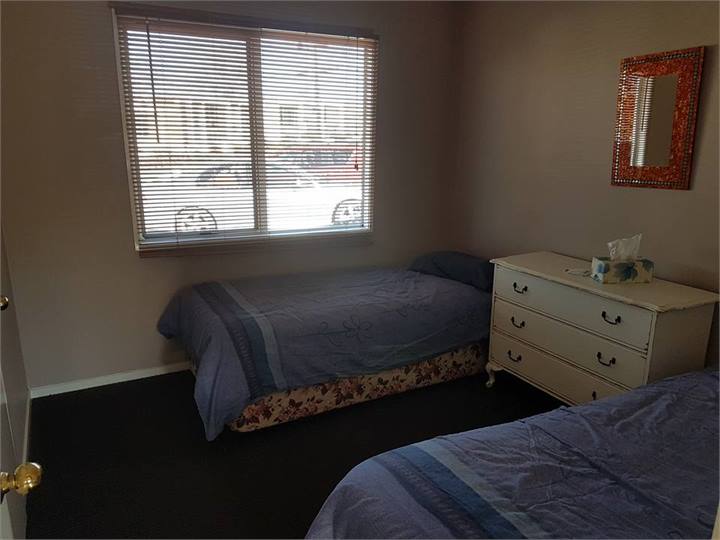 Bedroom three with 2 x single beds