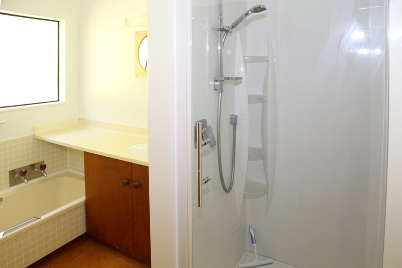 Upstairs bathroom with bath, vanity and shower