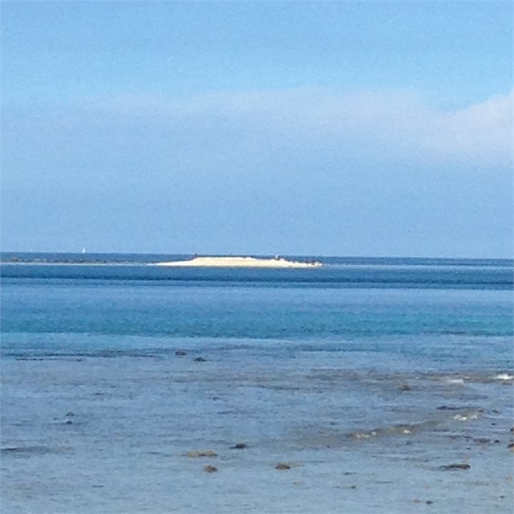 View from the shore to the sand island
