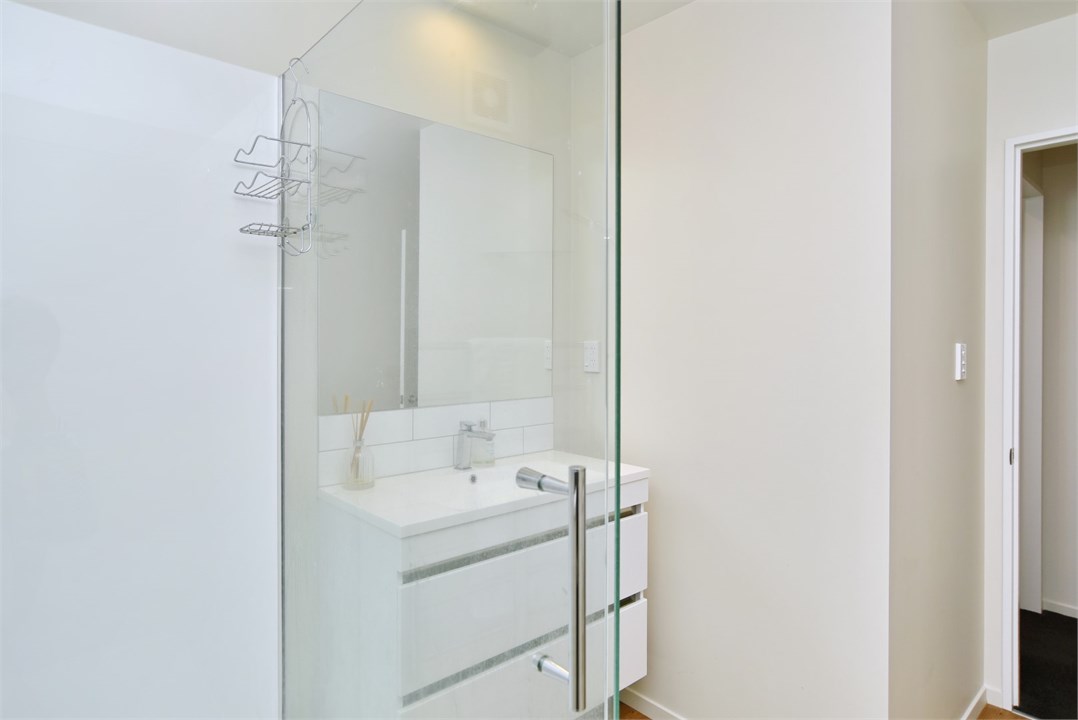 Bathroom has a shower and a toilet