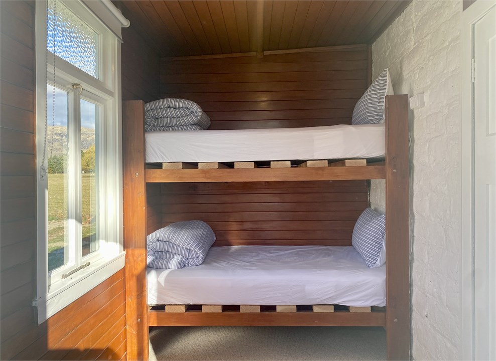 The cosy bunk room is accessed via the veranda.