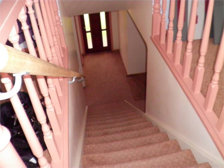 Looking down stairs to bedrooms and bathroom