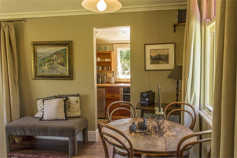 Looking past the dining area to the kitchen.