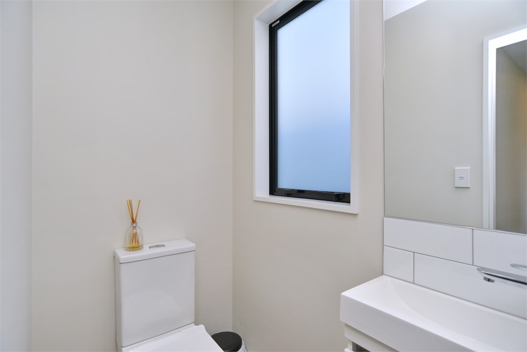 Bathroom has a shower and a toilet