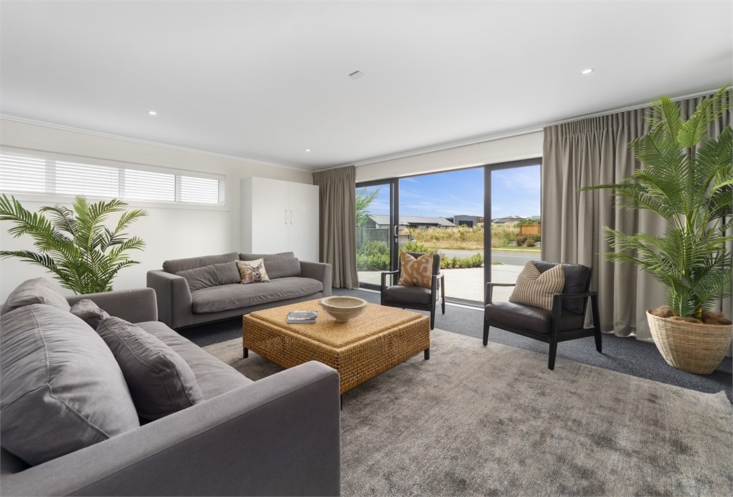 Media room with fold-down queen bed