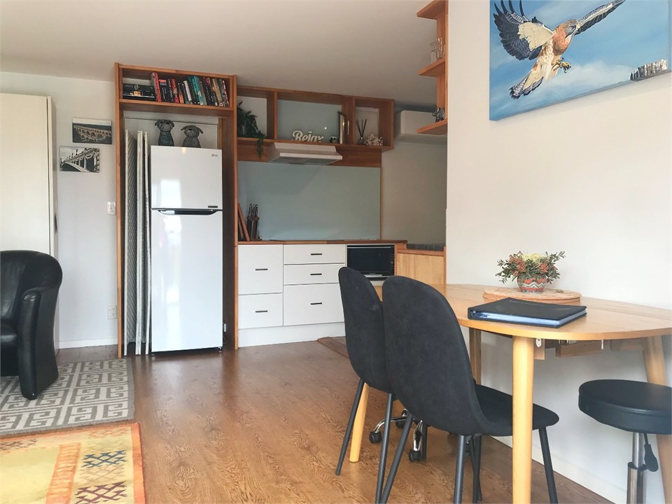 Four seater dining table with additional pull-out 