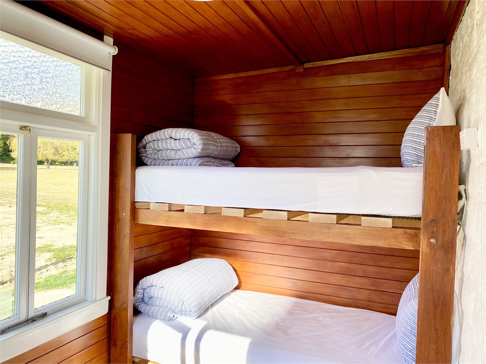 The cosy bunk room is accessed via the veranda.