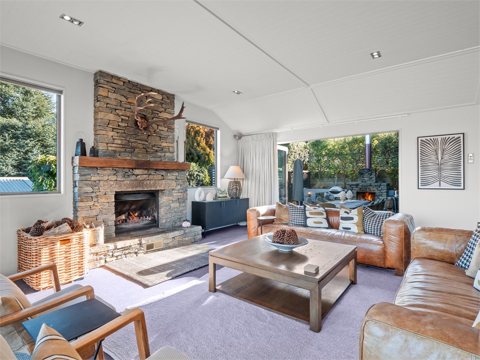 Lounge flows to large courtyard with outdoor firep