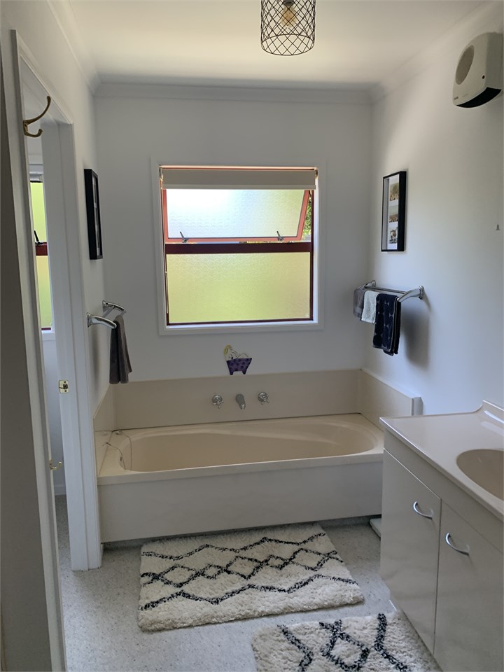 Main bathroom with shower and separate toilet