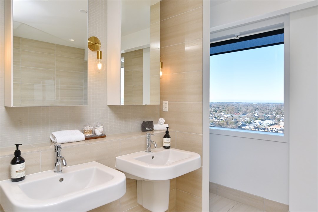 Bathroom 1 has a shower, bathtub and a toilet