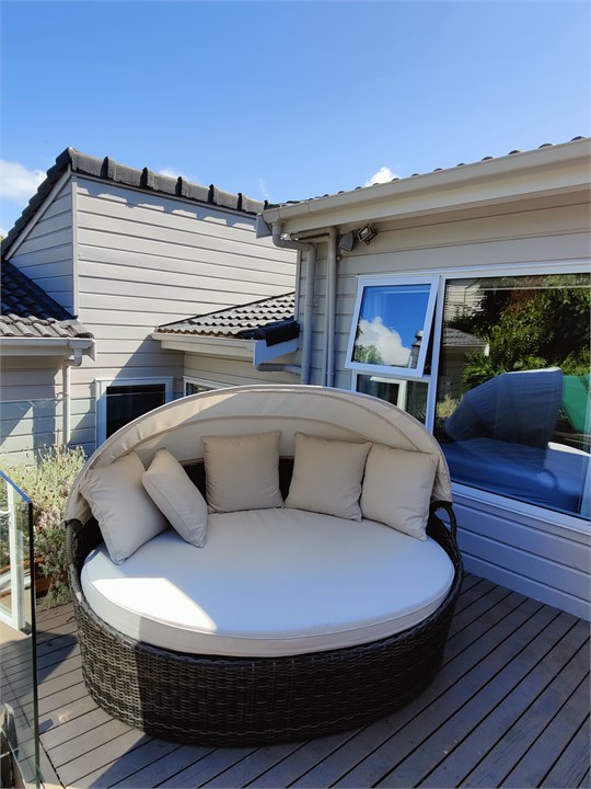 Relax on the day bed by the pool