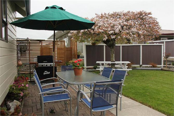 BBQ and outdoor seating area