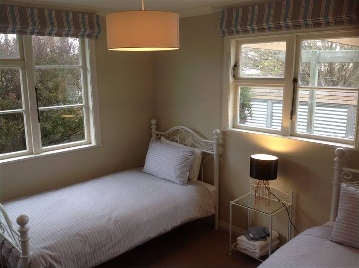 Bedroom 3: Two King Single Beds.