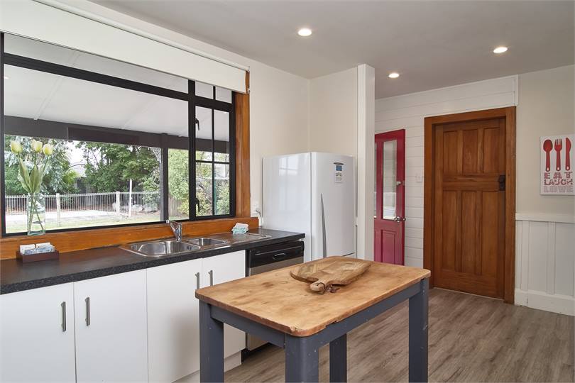 Kitchen with laundry and toilet off to the side