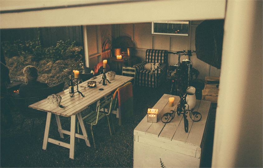 glass of wine by outdoor fire