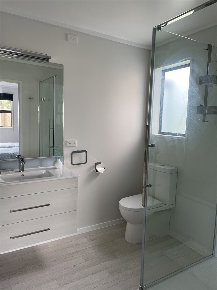 Downstairs. Ensuite bathroom off bedroom 3.