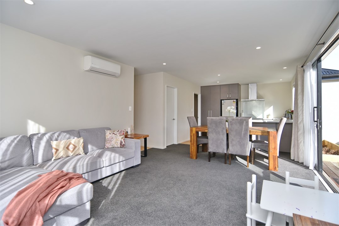 Living room with sitting areas and a TV