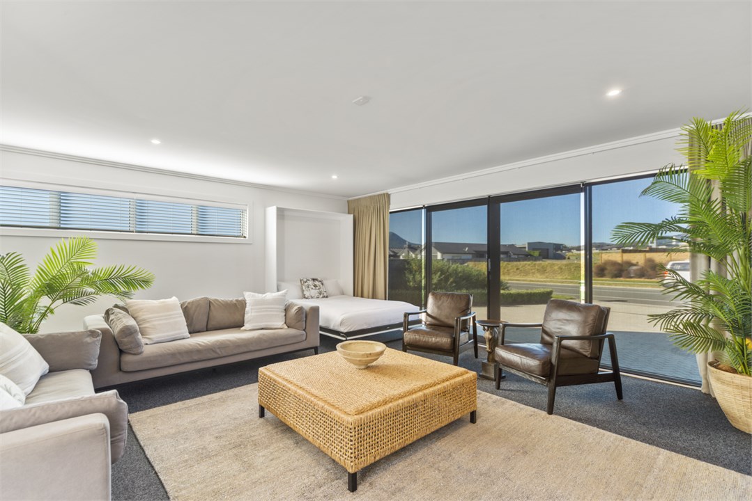 Media room with fold-down queen bed