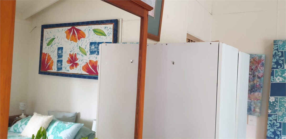 Reflection of bed in dressing table mirror