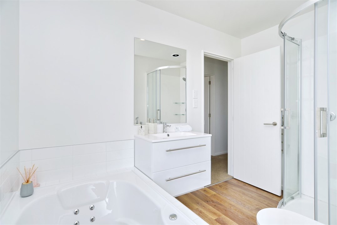 Main bathroom - has a spa bath, shower and toilet