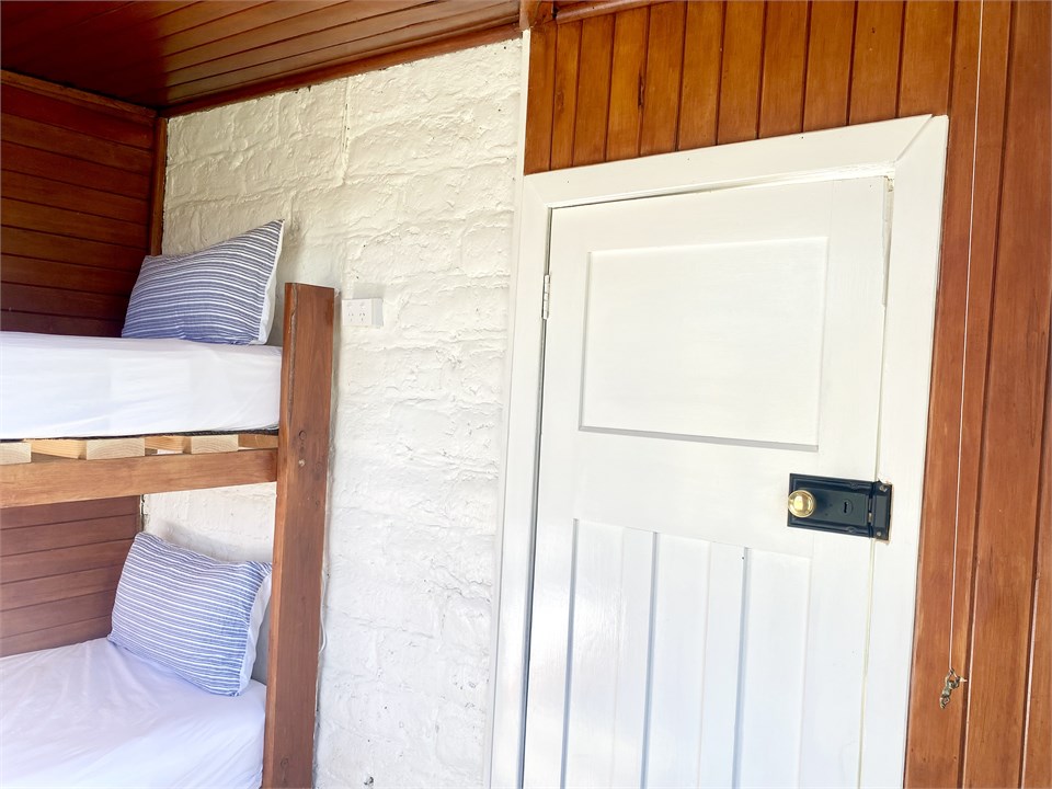 The cosy bunk room is accessed via the veranda.