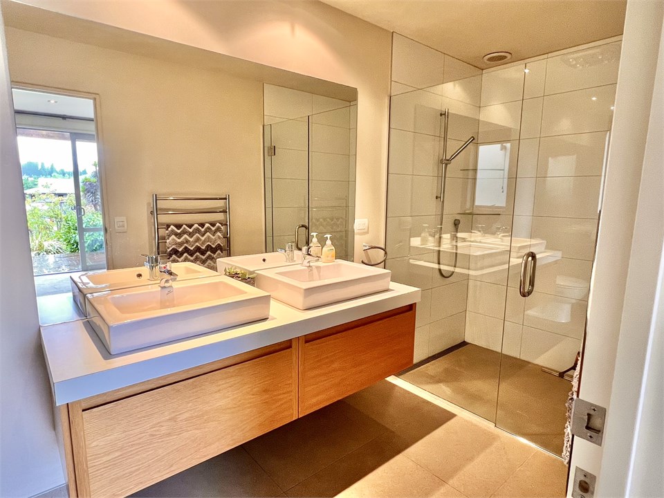 Bathroom 2 has a shower and a toilet